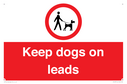 dogs-on-lead-symbol-with-black-text-on-white-background~